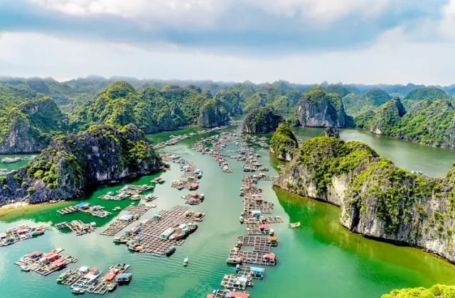 Fishing boats in a bay between limestone karst islands