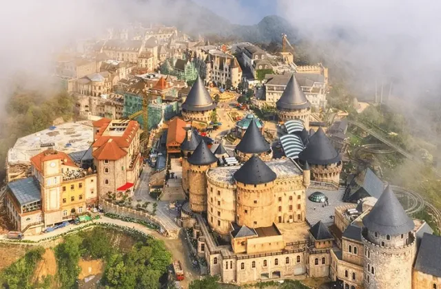 A hilltop castle-style village wrapped in mist
